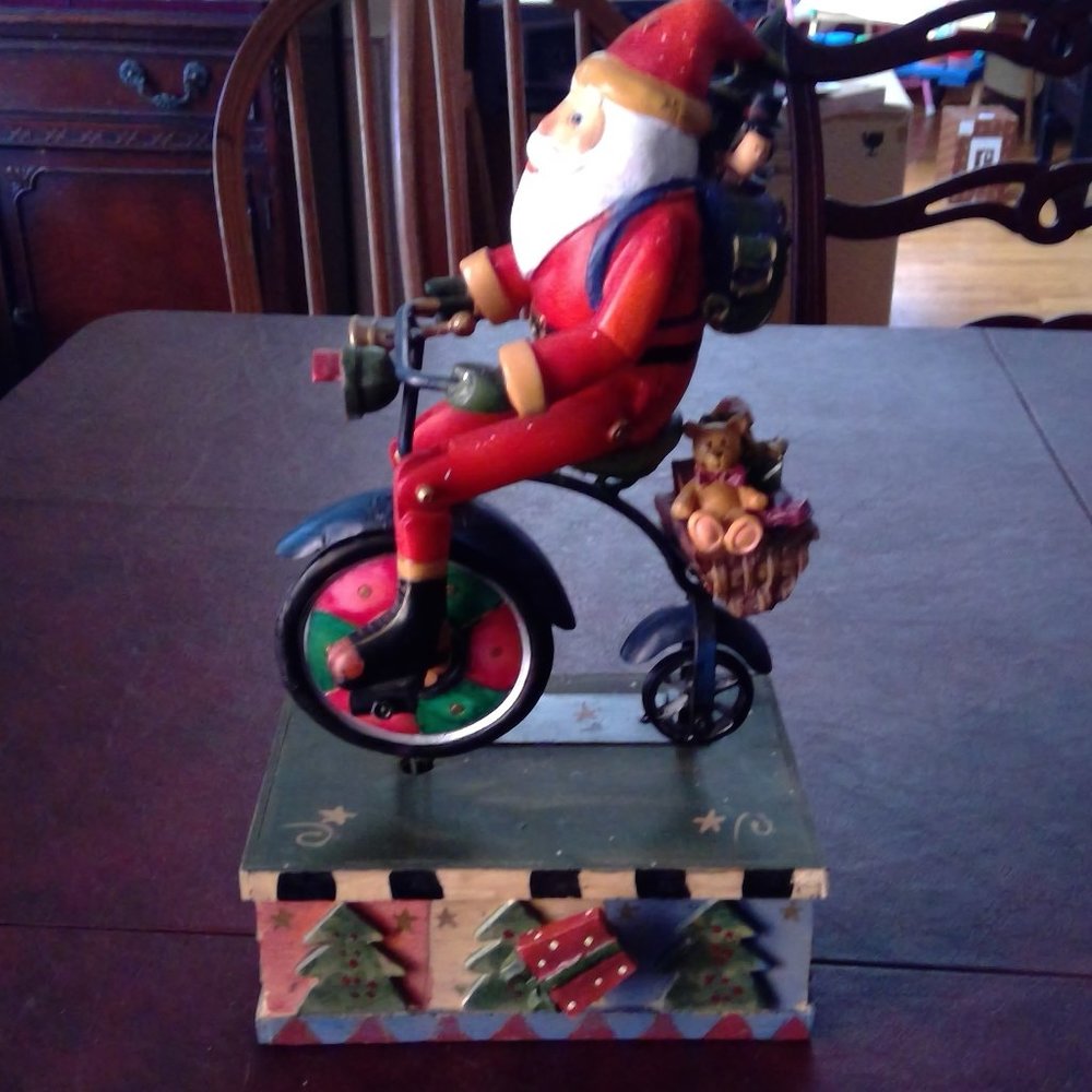Musical moving Santa figure